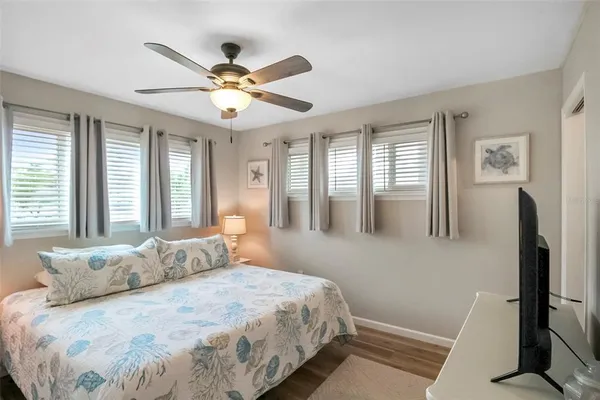 a bedroom with a bed and window