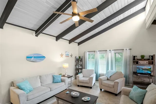 a view of a livingroom with furniture and flat screen tv