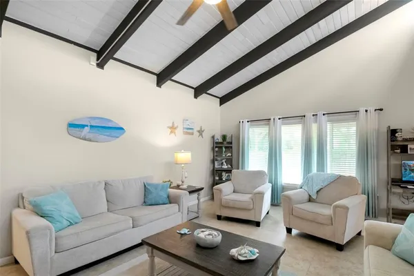 a living room with furniture and a table