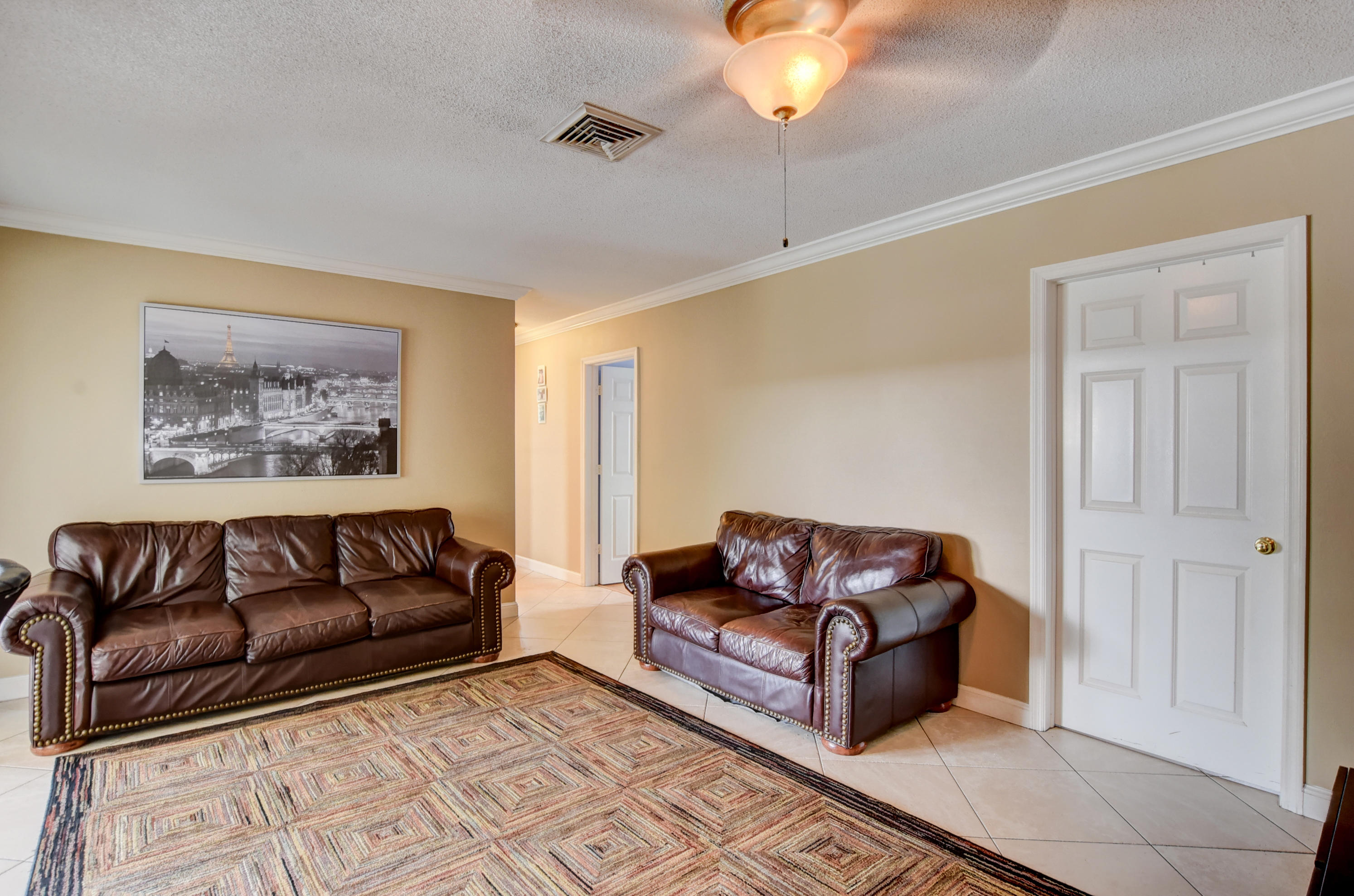 1366 Southwest 13th Place Boca Raton, FL 33486 - Photo 19 of 35 a living room with furniture and a couch