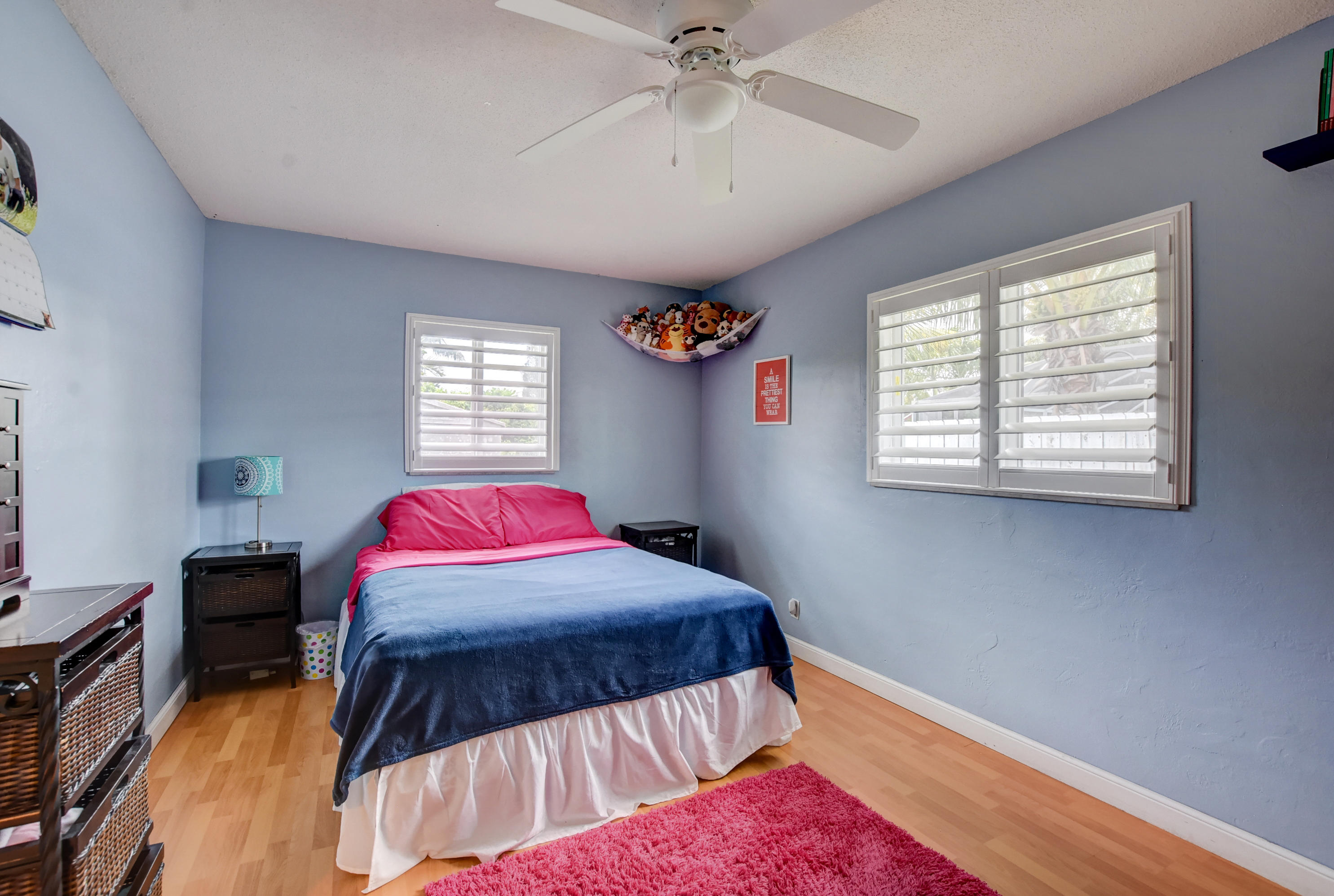 1366 Southwest 13th Place Boca Raton, FL 33486 - Photo 28 of 35 a view of a bedroom with natural light and window