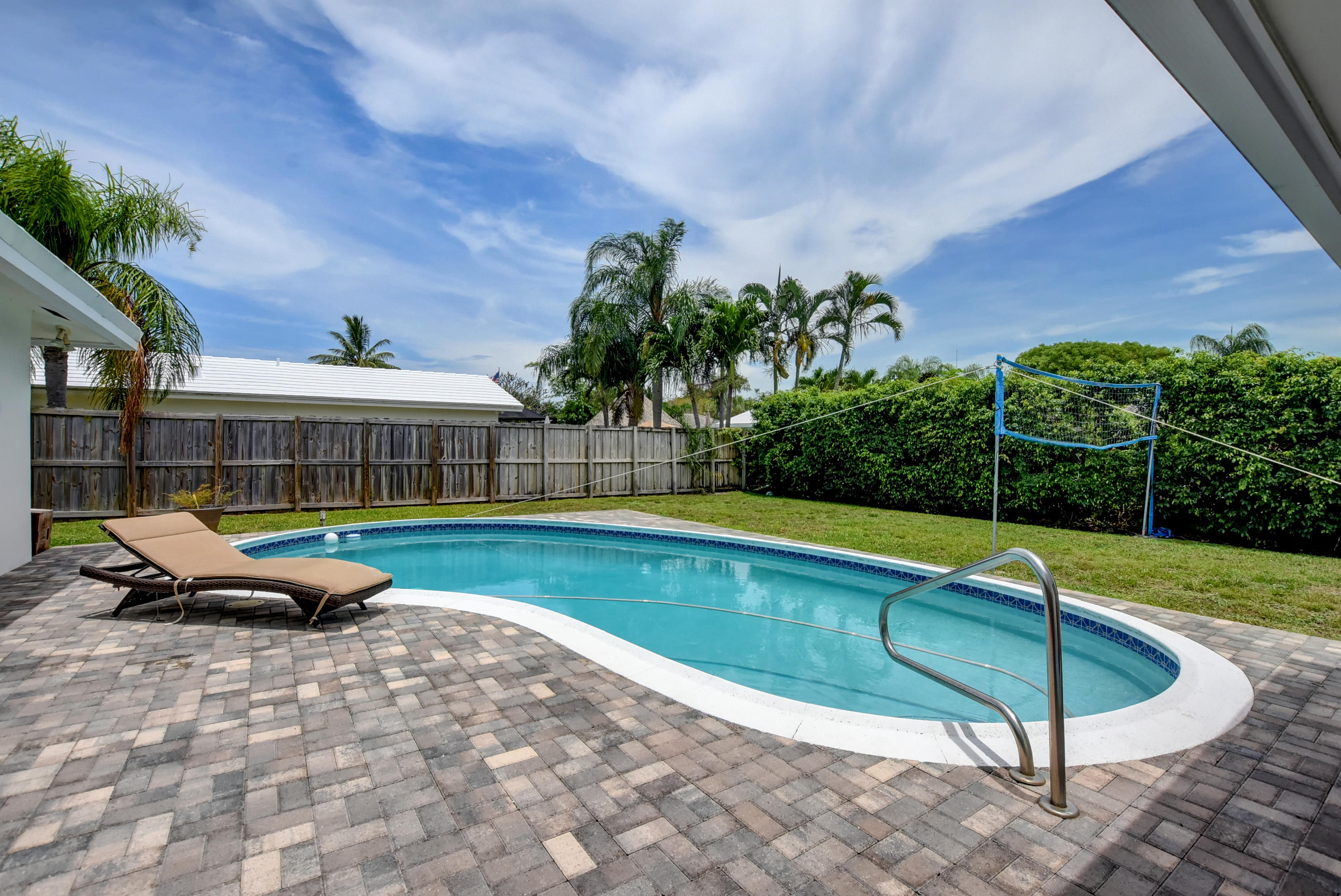1366 Southwest 13th Place Boca Raton, FL 33486 - Photo 31 of 35 a view of swimming pool with lounge chair