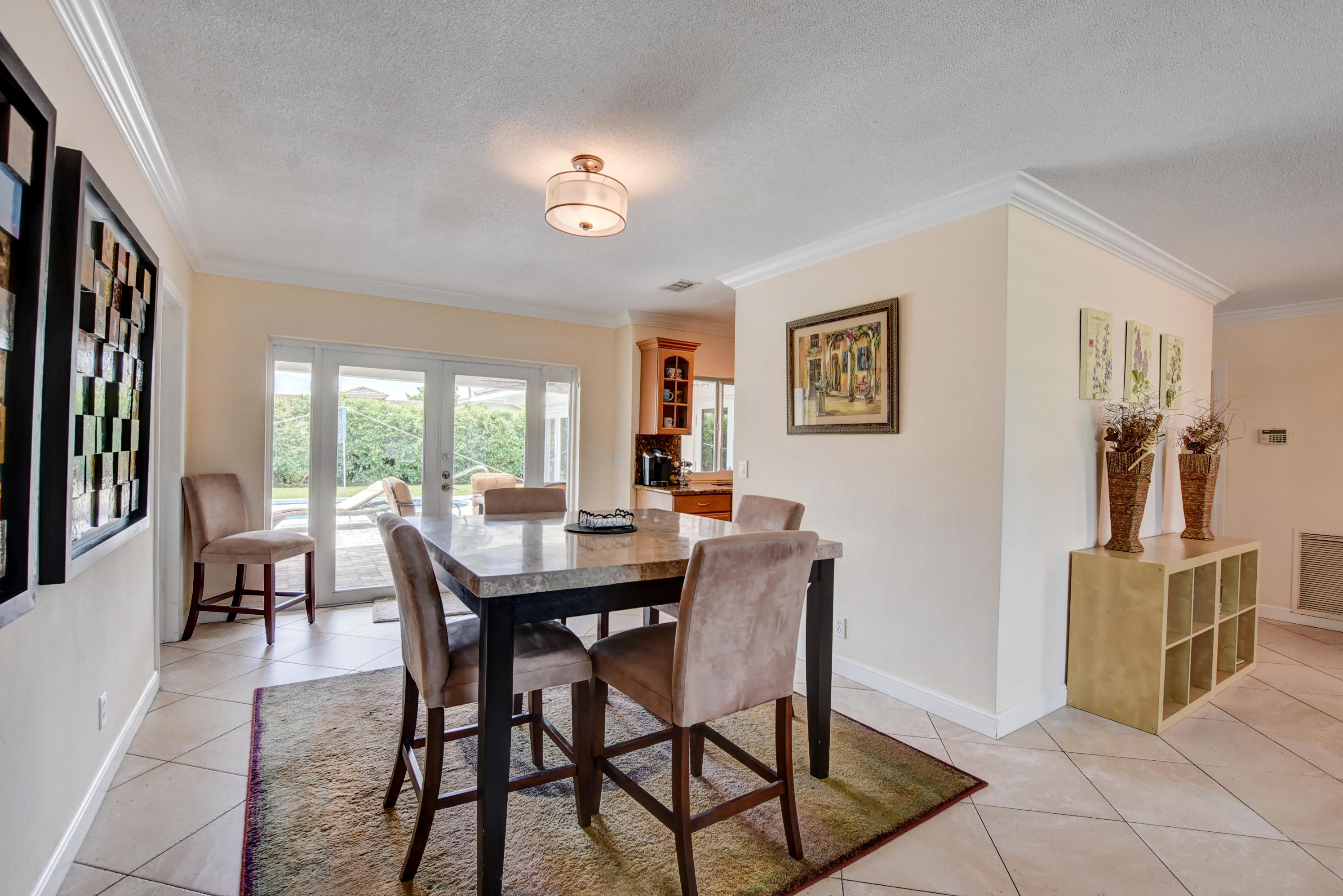 1366 Southwest 13th Place Boca Raton, FL 33486 - Photo 9 of 35 a view of a dining room with furniture