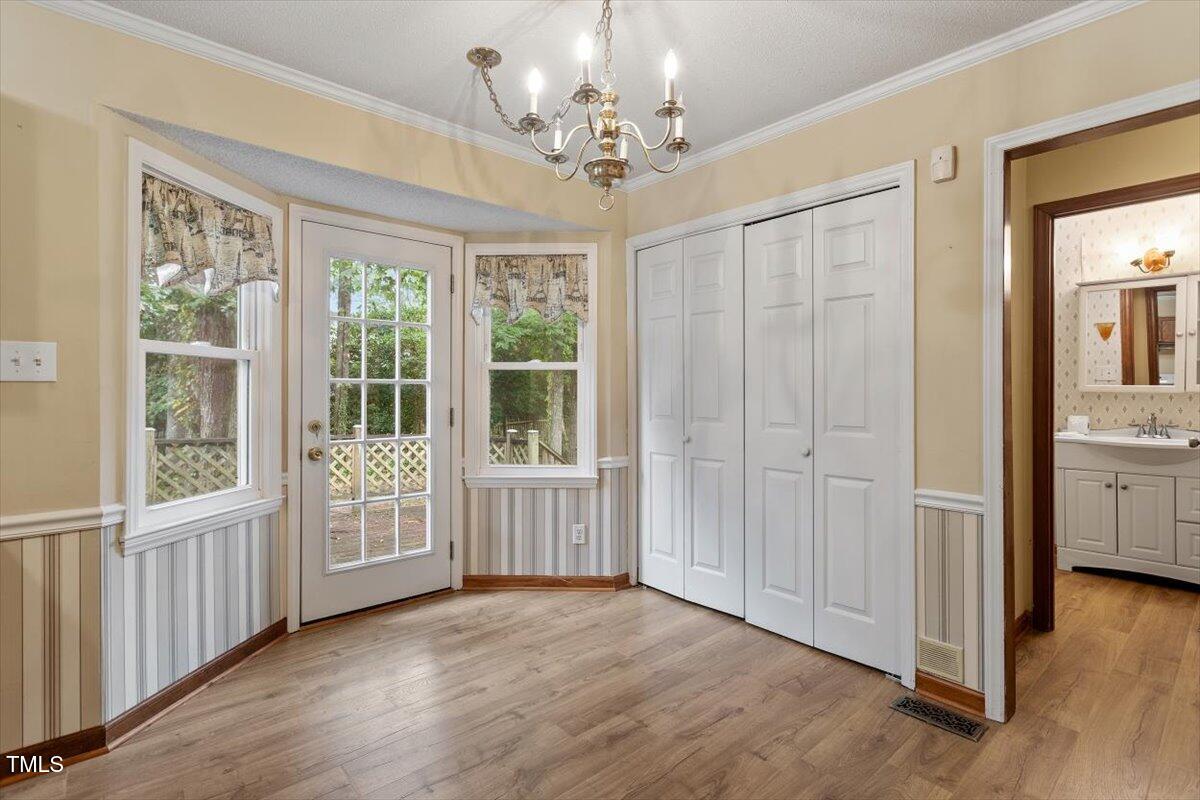 4616 Draper Road Raleigh, NC 27616 - Photo 12 of 34 a view of a room with a window and wooden floor