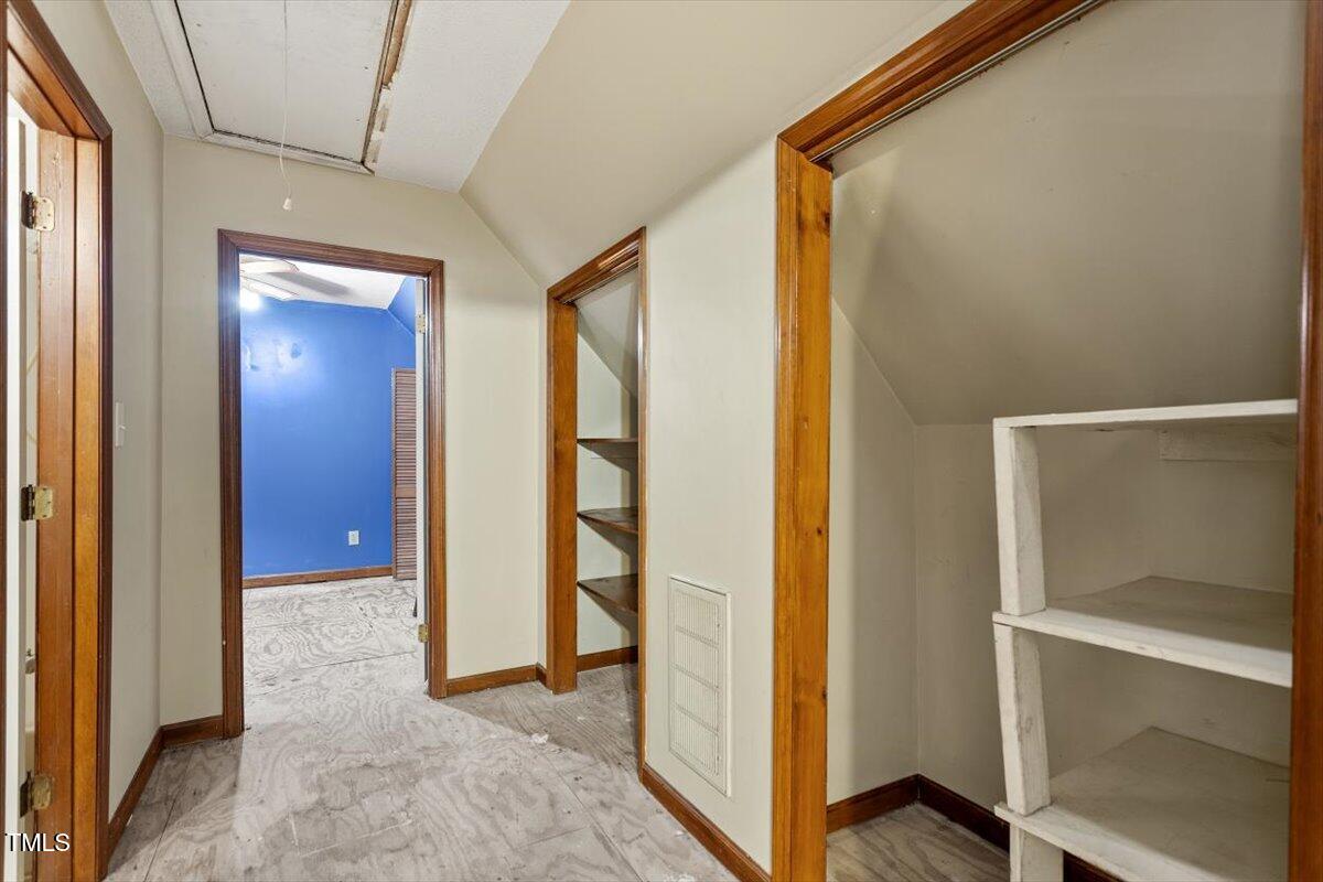 4616 Draper Road Raleigh, NC 27616 - Photo 19 of 34 a view of a hallway with wooden floor