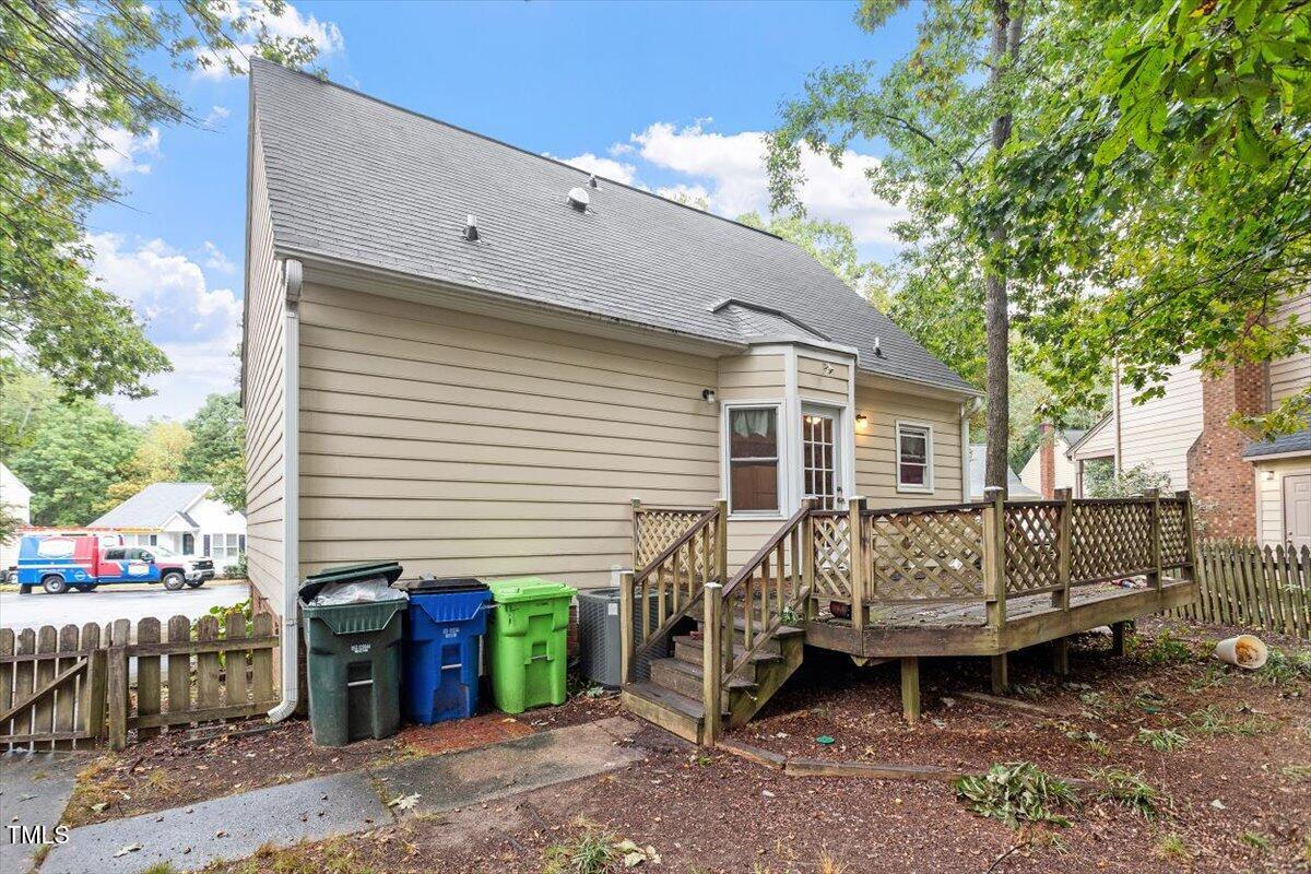 4616 Draper Road Raleigh, NC 27616 - Photo 28 of 34 a view of a house with a yard and wooden fence
