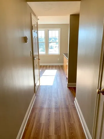 a view of entryway with wooden floor