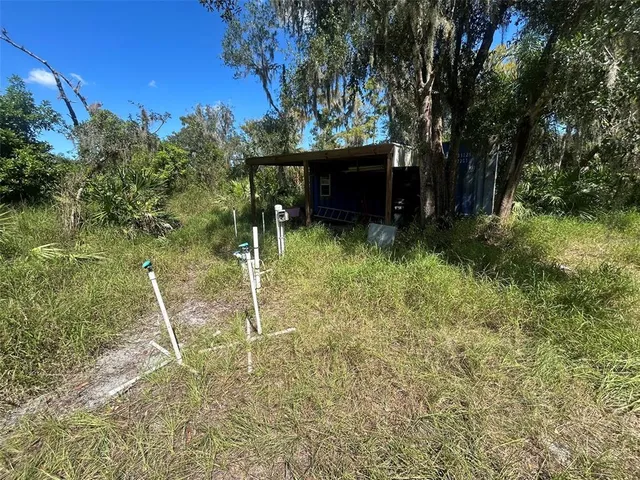 a backyard of a house with lots of green space