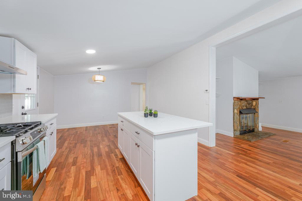 426 7th Street Somers Point, NJ 08244 - Photo 15 of 22 a kitchen with wooden floor and electronic appliances