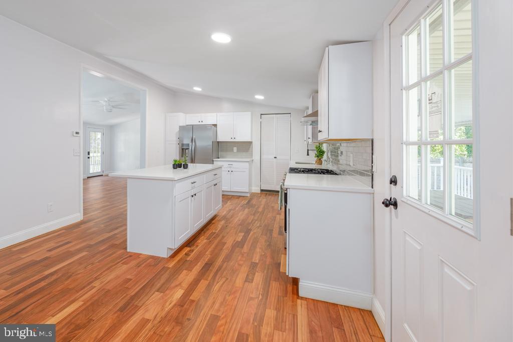 426 7th Street Somers Point, NJ 08244 - Photo 16 of 22 a kitchen with stainless steel appliances a refrigerator a sink dishwasher and a stove with wooden floor
