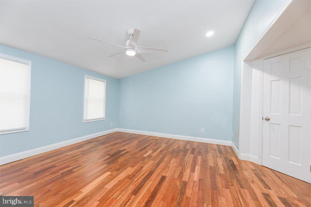 426 7th Street Somers Point, NJ 08244 - Photo 18 of 22 wooden floor in an empty room with a window