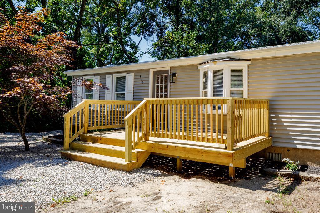 426 7th Street Somers Point, NJ 08244 - Photo 4 of 22 a view of a house with a yard chairs and wooden fence