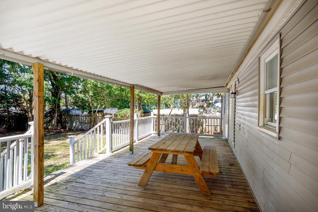 426 7th Street Somers Point, NJ 08244 - Photo 10 of 22 a balcony with wooden floor and furniture