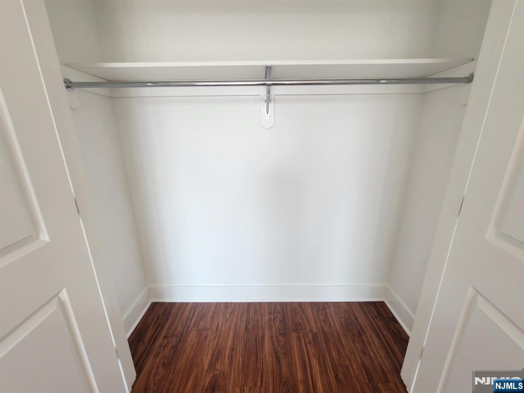 77 Ridge, Unit 108 North Arlington, NJ 07032 - Photo 17 of 24 a view of a room with wooden floor and closet