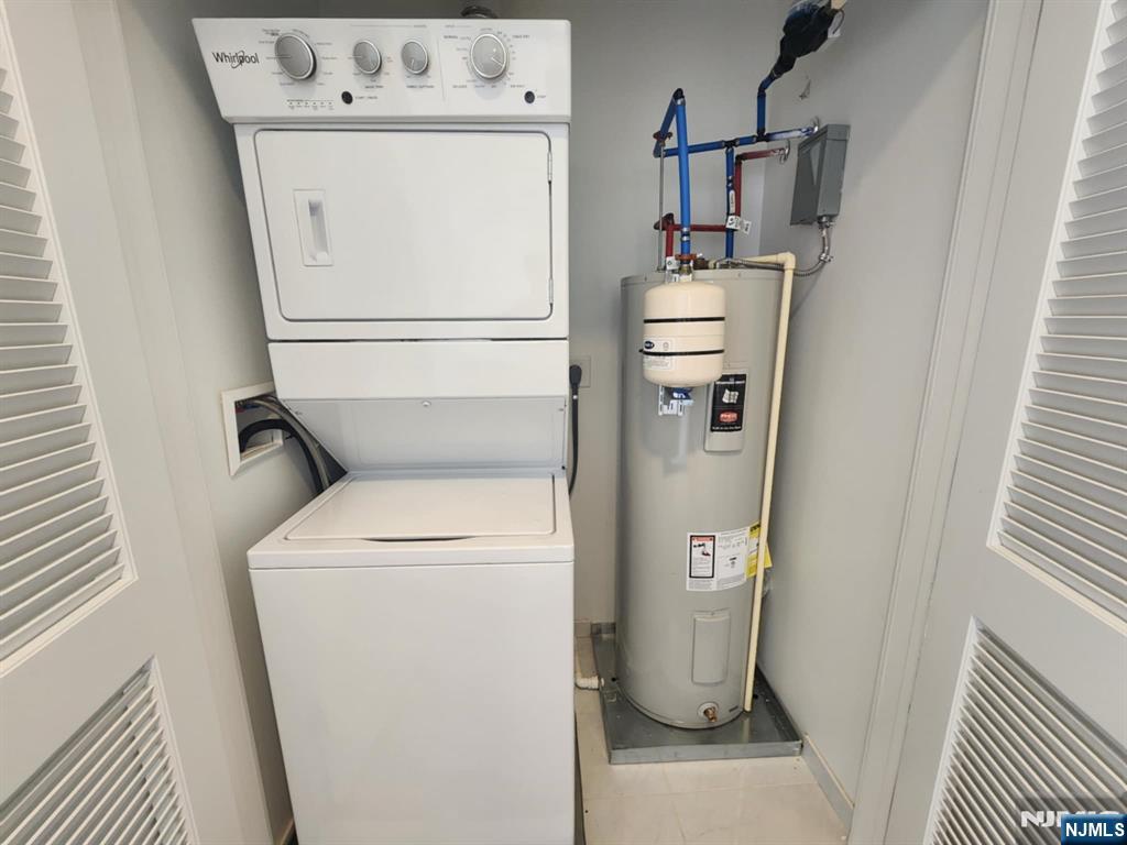 77 Ridge, Unit 108 North Arlington, NJ 07032 - Photo 18 of 24 a utility room with dryer and washer