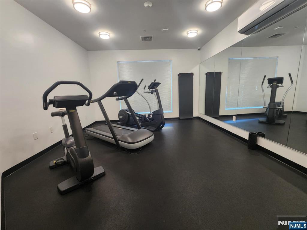 77 Ridge, Unit 108 North Arlington, NJ 07032 - Photo 20 of 24 a view of a room with gym equipment