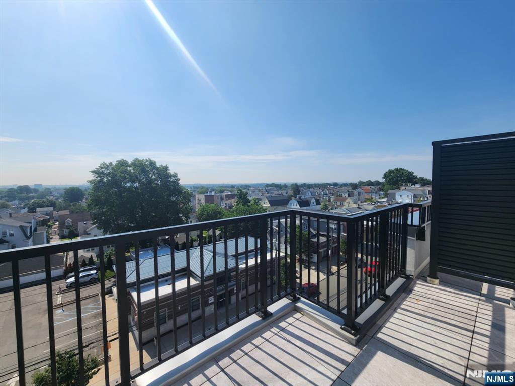 77 Ridge, Unit 108 North Arlington, NJ 07032 - Photo 24 of 24 a view of city from a balcony