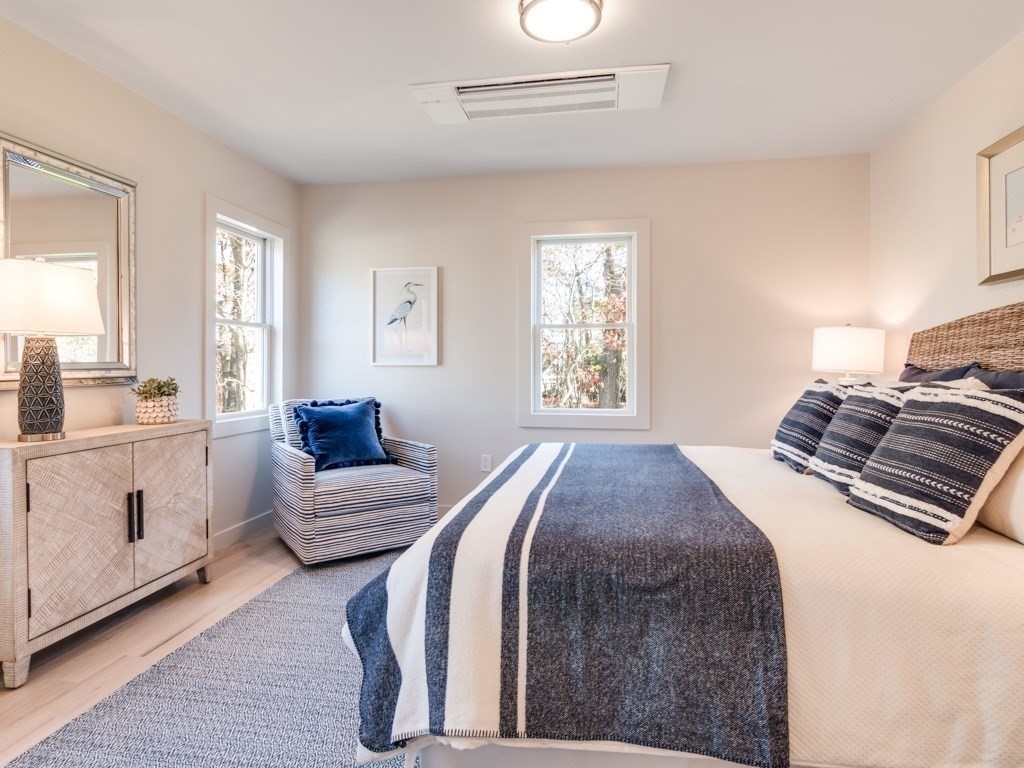 302 Western Avenue, Unit B Gloucester, MA 01930 - Photo 12 of 33 a bedroom with a bed and a couch