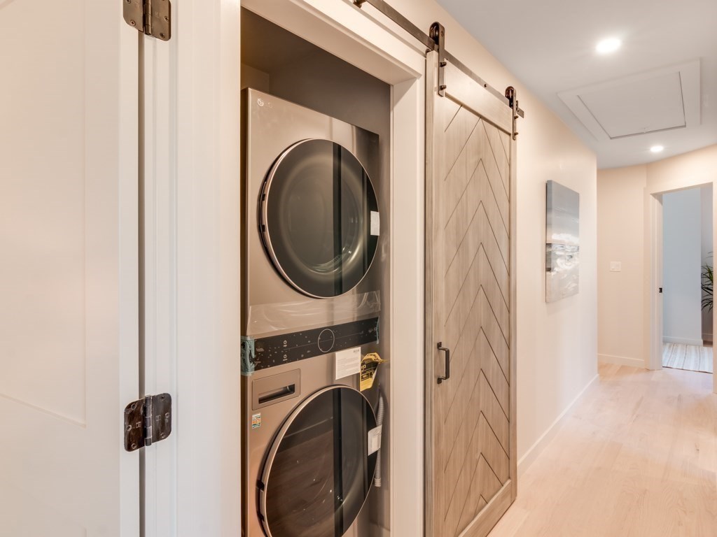 302 Western Avenue, Unit B Gloucester, MA 01930 - Photo 14 of 33 a view of a hallway with washer and dryer