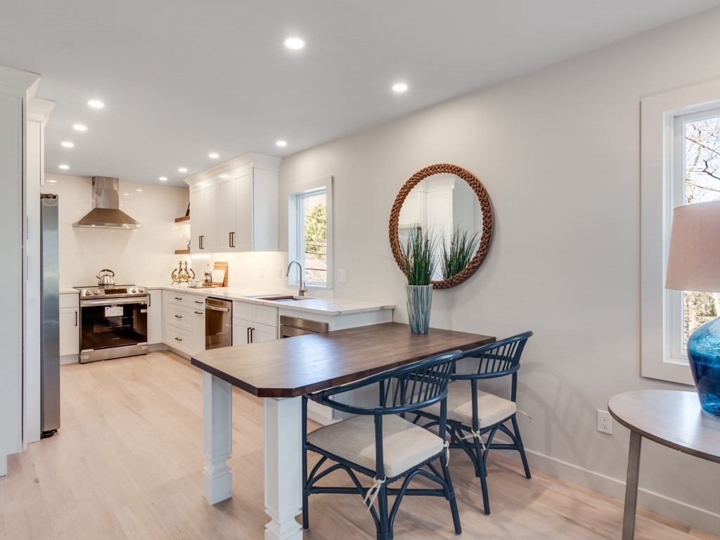 302 Western Avenue, Unit B Gloucester, MA 01930 - Photo 3 of 33 a view of a dining room with furniture and chandelier