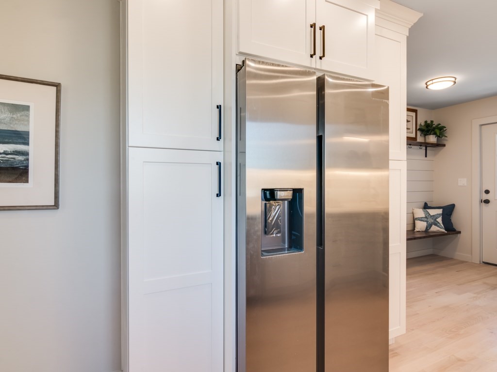 302 Western Avenue, Unit B Gloucester, MA 01930 - Photo 31 of 33 a metallic refrigerator freezer sitting in a kitchen