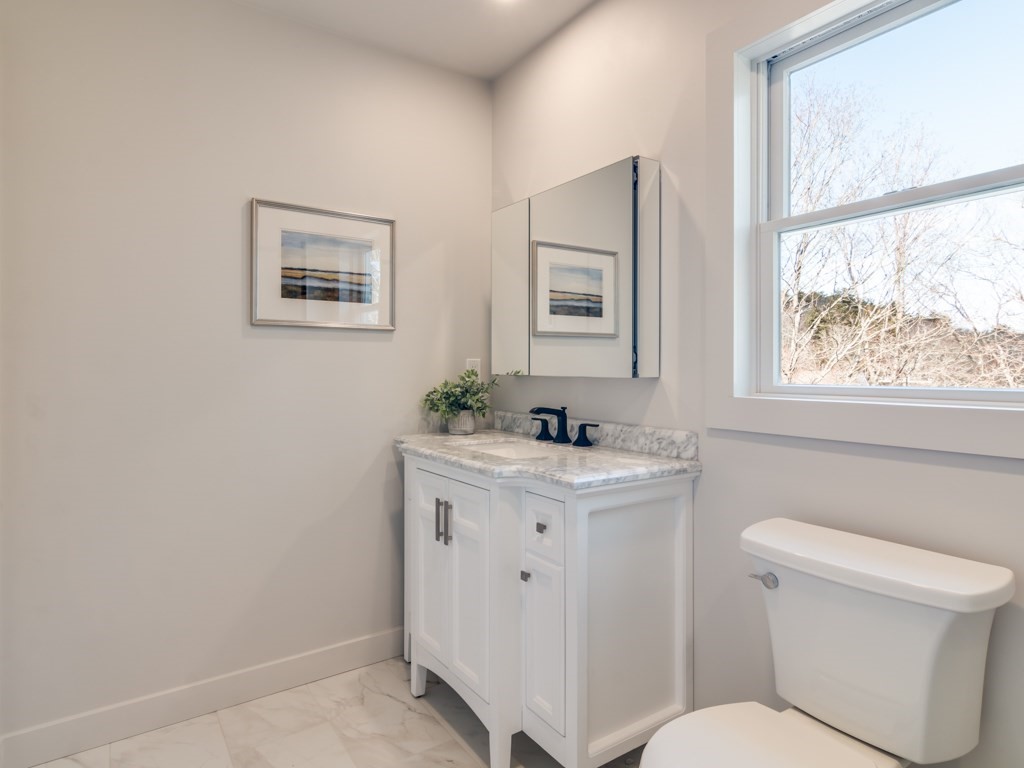 302 Western Avenue, Unit B Gloucester, MA 01930 - Photo 33 of 33 a view of bathroom with a toilet sink and mirror