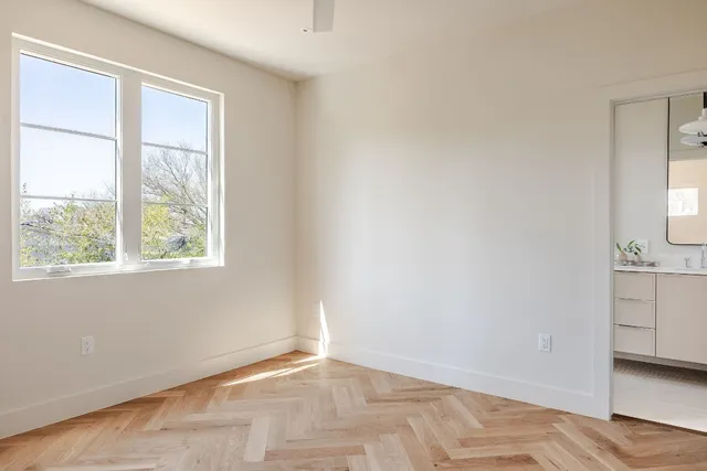 a view of an empty room with a window