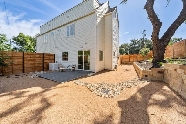 a view of a backyard with a patio