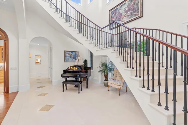 a view of entryway with wooden floor and a front door