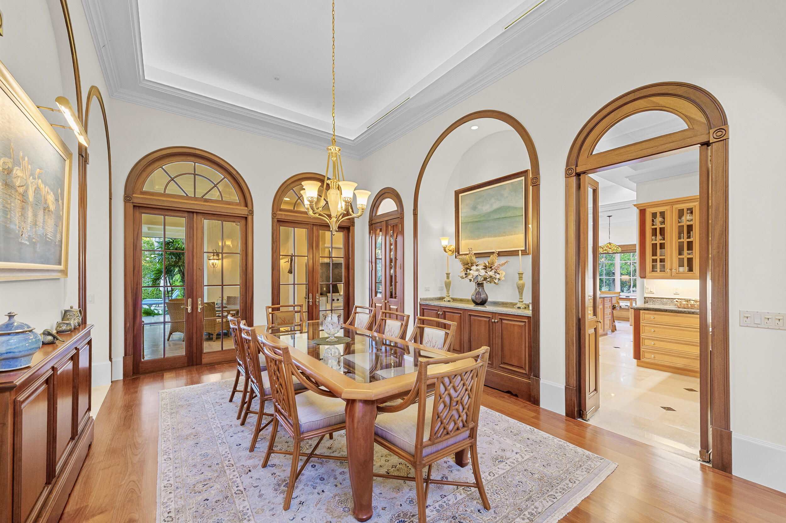 6968 Southeast Harbor Circle Stuart, FL 34996 - Photo 14 of 40 a view of a dining room with furniture window and wooden floor