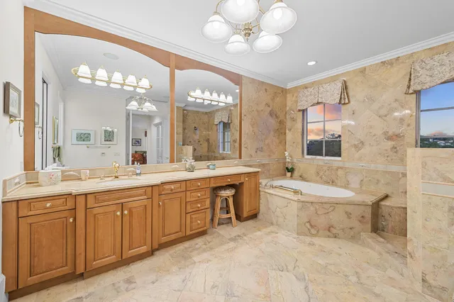 a spacious bathroom with a double vanity sink a large mirror and a bathtub