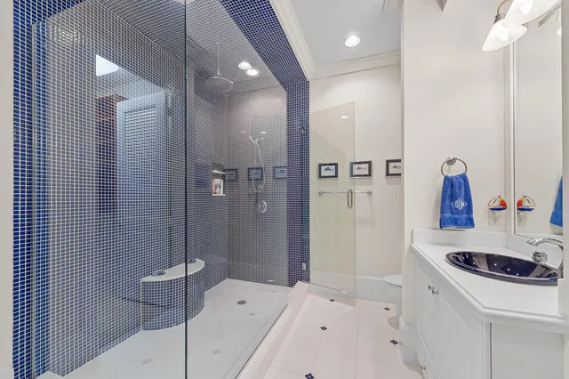 a bathroom with a sink a tub and shower