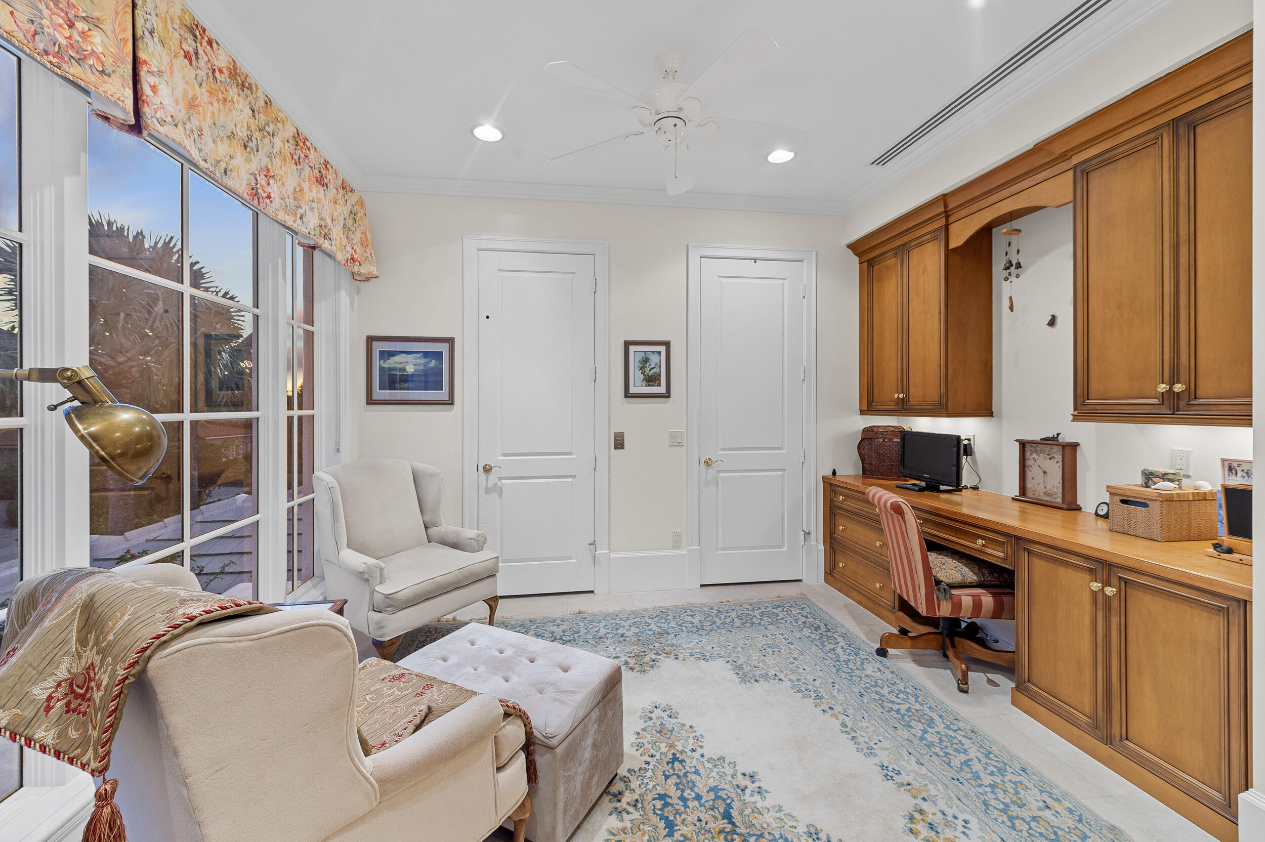 6968 Southeast Harbor Circle Stuart, FL 34996 - Photo 24 of 40 a spacious bedroom with a bed a couch and cabinet