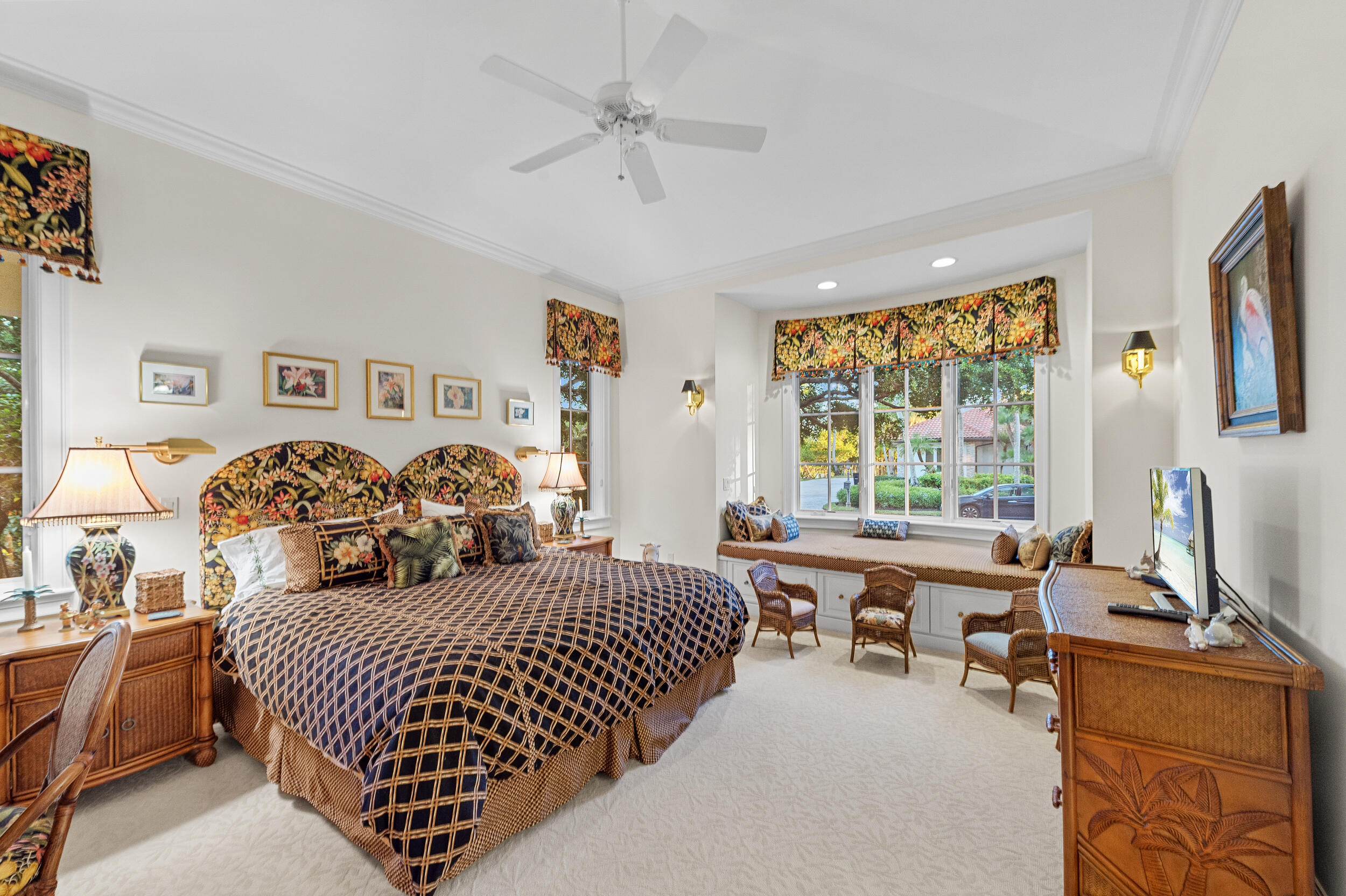 6968 Southeast Harbor Circle Stuart, FL 34996 - Photo 25 of 40 a bedroom with double bed and a window