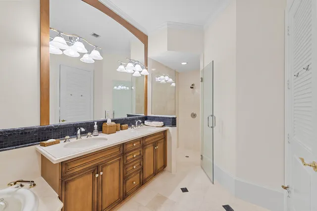 a bathroom with a sink vanity and a mirror