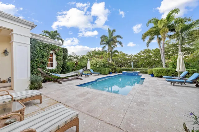 a view of outdoor space with swimming pool and lounge chair