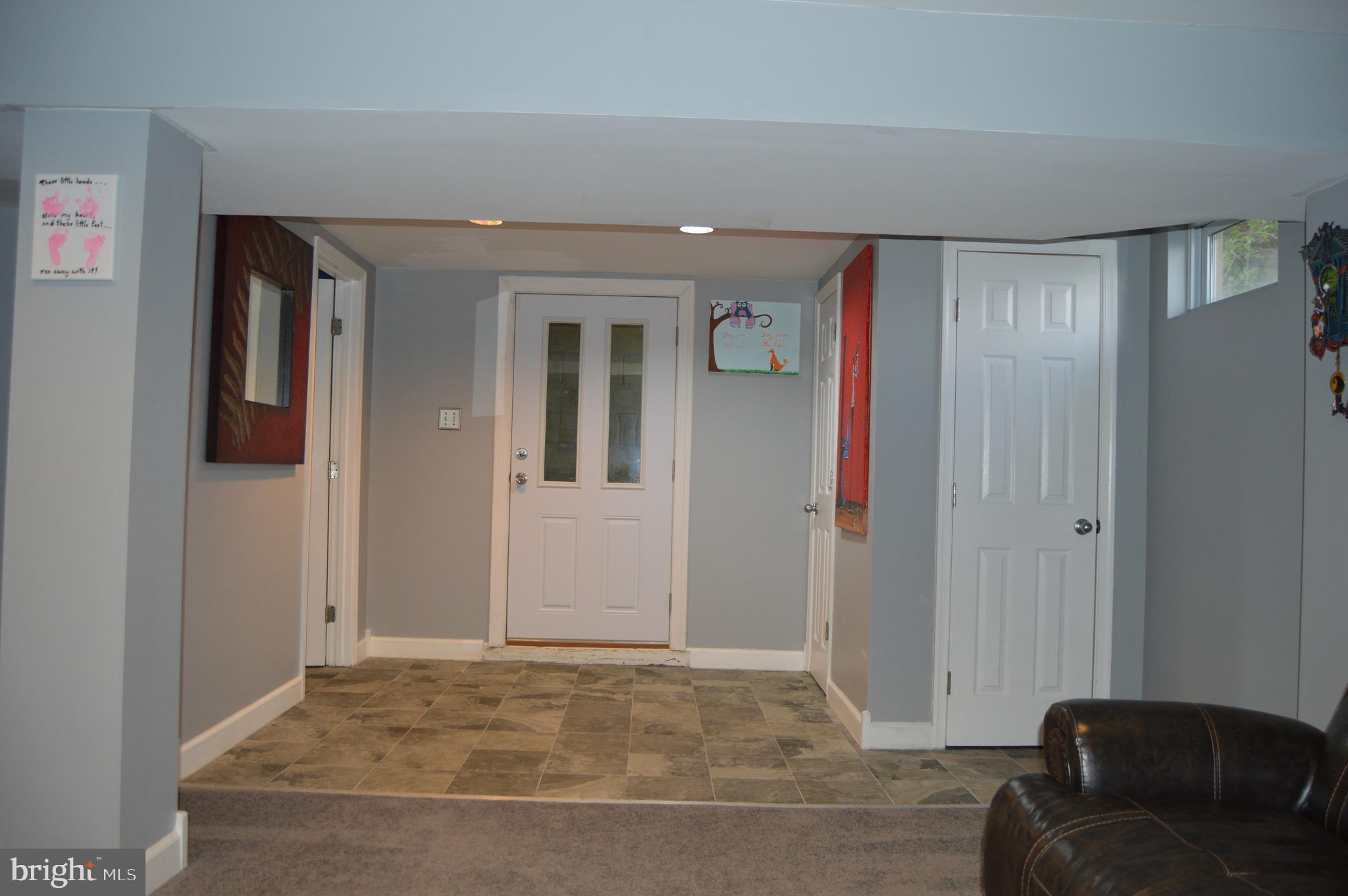 630 North Hammonds Ferry Road Linthicum, MD 21090 - Photo 22 of 26 Lower Level Tile Foyer