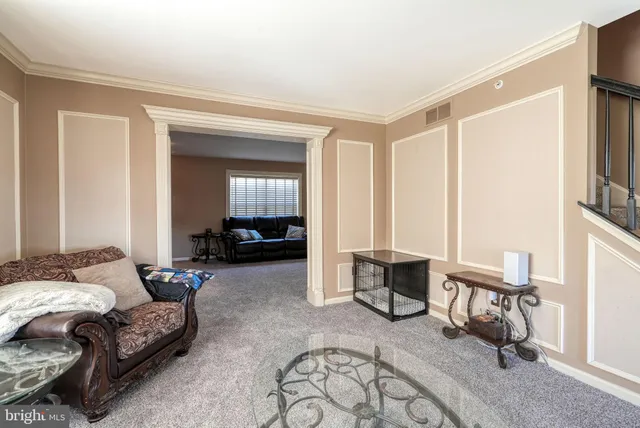 a bedroom with furniture and a wooden floor