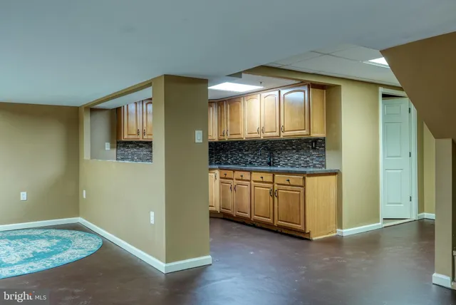 a view of kitchen with cabinets and wooden floor