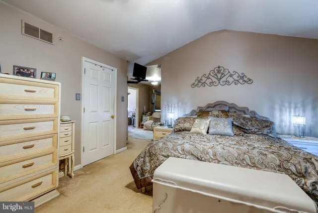 a bedroom with a bed and a cabinets