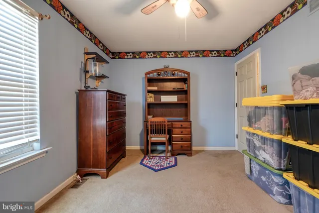 a view of an empty room and a window