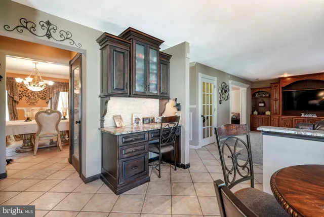 a view of a livingroom with furniture and a flat screen tv