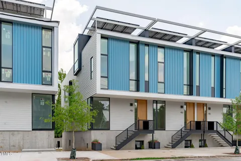 a view of a house with a windows and a table and chairs