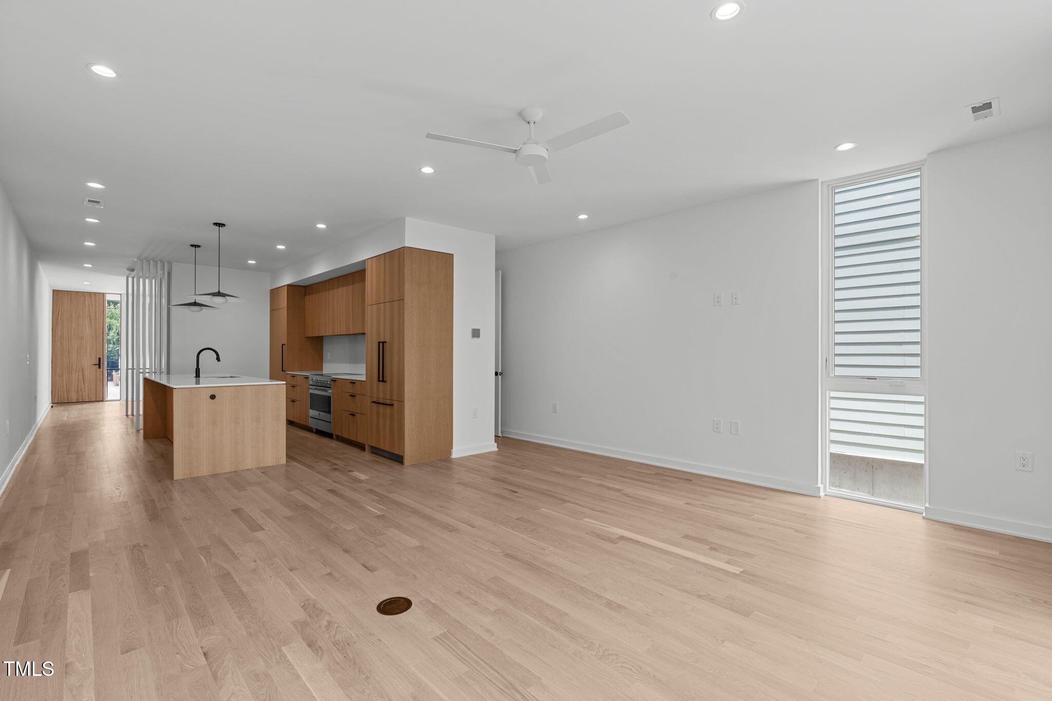 511 South Bloodworth Street, Unit 101 Raleigh, NC 27601 - Photo 14 of 51 a view of a kitchen with a sink and a large window