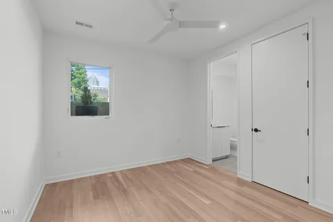 a view of an entryway with wooden floor