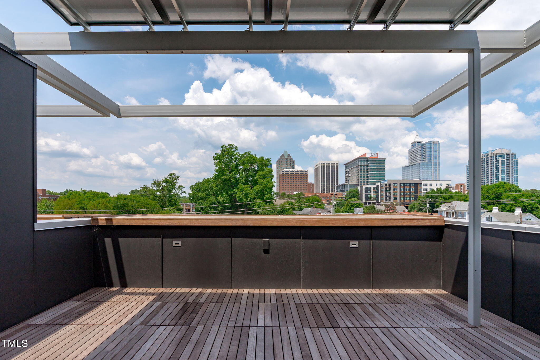 511 South Bloodworth Street, Unit 101 Raleigh, NC 27601 - Photo 28 of 51 a view of a balcony with wooden floor