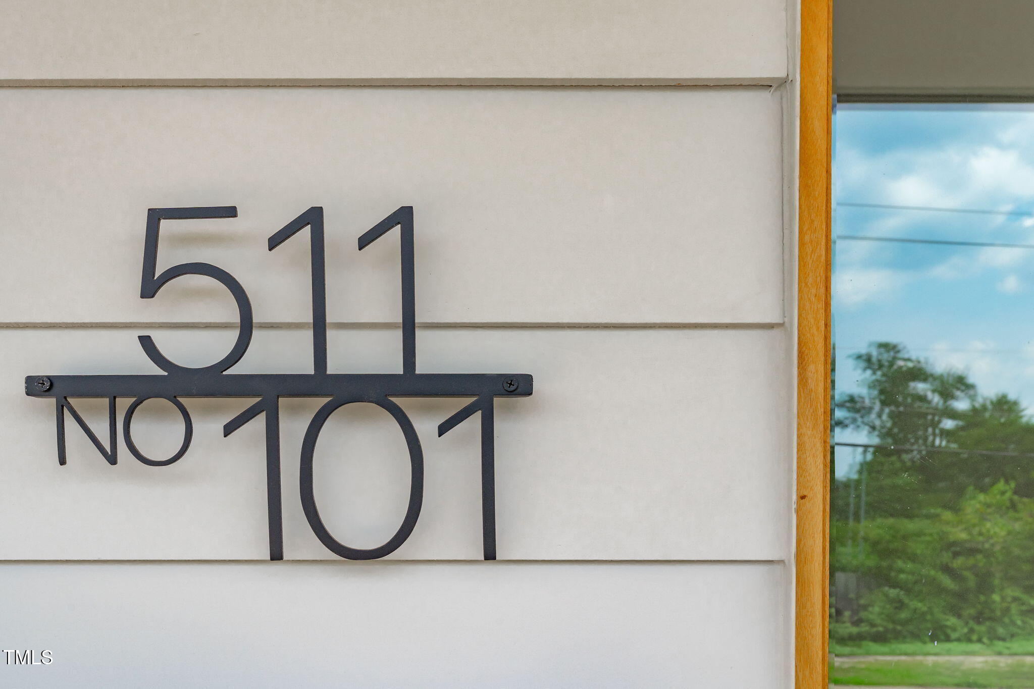 511 South Bloodworth Street, Unit 101 Raleigh, NC 27601 - Photo 31 of 51 a bathroom with a granite countertop shower a mirror and a sink