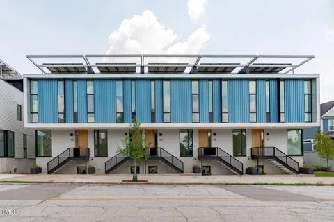 a front view of a house with a yard outdoor seating and entertaining space