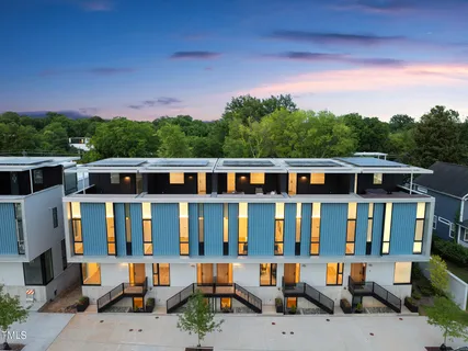 a view of a city that has lawn chairs and a table