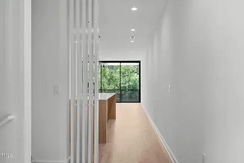 a view of hallway with a large window